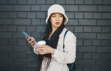 Image showing City, thinking and coffee with a smartphone, woman and connection on a wall background. Person, ideas or girl with cellphone, mobile user or outdoor with digital app, tea or espresso with inspiration