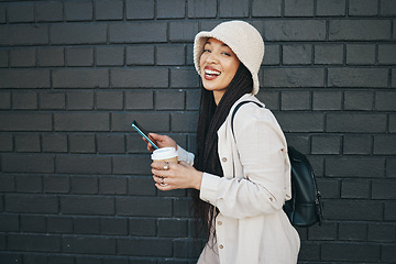 Image showing Portrait of happy woman with phone, wall background and urban fashion, social media chat and internet meme. Streetwear, gen z girl or online influencer with smartphone, smile and communication mockup