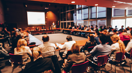 Image showing Public speaker giving talk at business event.