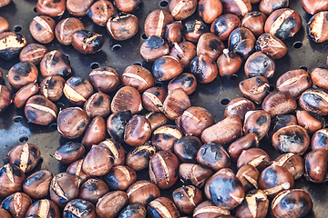 Image showing Grilling chestnuts.