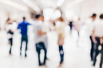 Image showing Abstract blurred people socializing during coffee break at business conference.