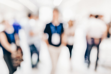 Image showing Abstract blurred people socializing during coffee break at business conference.