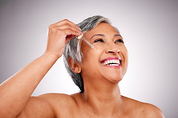 Image showing Studio face, mature happy woman or serum hydration, self care and application of facial oil, hyaluronic acid or wellness. Pipette, skincare shine and person thinking of anti aging on white background