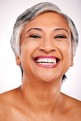 Image showing Senior, happy woman and portrait with teeth in dental, hygiene or skincare against a studio background. Closeup or face of mature female person smile for tooth whitening, mouth or oral and gum care