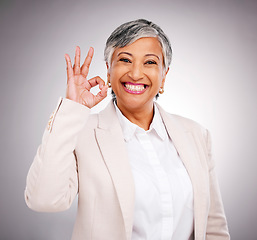 Image showing Okay sign, studio and portrait of business woman smile for success, approval and agreement. Success, corporate and face of mature person with hand gesture for like, yes and emoji on gray background