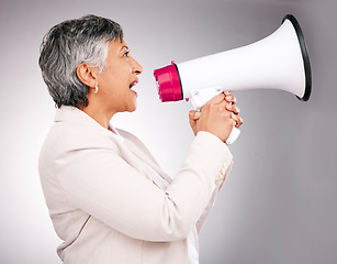 Image showing Business woman, megaphone and protest, breaking news or broadcast for gender equality and justice in studio. Serious manager or leader with call to action, attention and warning on white background