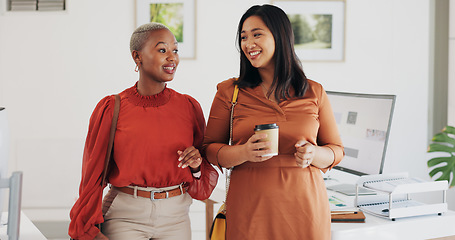 Image showing Business people, walking and happy conversation in an office with coffee, smile or friendly chat. Work, friends and women with diversity, discussion or gossip, news or project, idea or communication