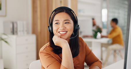 Image showing Call center, woman and thinking with smile in office for CRM questions, FAQ contact and IT support. Happy asian telemarketing agent at computer of sales advisory, telecom solution or consulting ideas