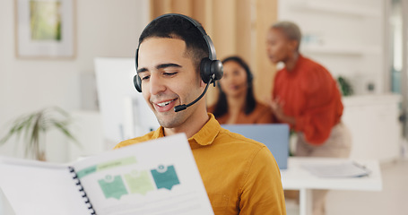 Image showing Call center, man and consulting documents in office for CRM report, FAQ proposal and IT support. Telemarketing agent reading notes, information folder and planning sales advisory for telecom solution