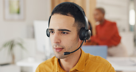 Image showing Call center, consultant and face of man in office for CRM questions, FAQ contact and IT support. Telemarketing agent with microphone for sales advisory, telecom solution or offer service at help desk