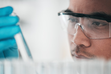 Image showing Science, research and man with glasses, test tube and biotech in laboratory, solution for vaccine or medical innovation. Healthcare, lab analytics and medicine, scientist in eco pharmaceutical study.