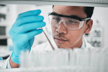 Image showing Lab scientist, test tube and face of man in laboratory studying chemical analysis, pharma research and vaccine development. Science, asian chemistry technician and assessment of sample for innovation