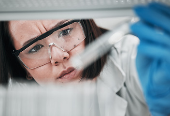 Image showing Test tubes, scientist and woman with investigation, thinking and science research of an Asian person. Laboratory, professional and healthcare worker with medicine and liquid check for hospital test