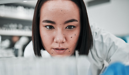 Image showing Test tubes, scientist and woman with doctor investigation, thinking and science research. Laboratory, medical professional and healthcare worker with medicine and liquid check for hospital test