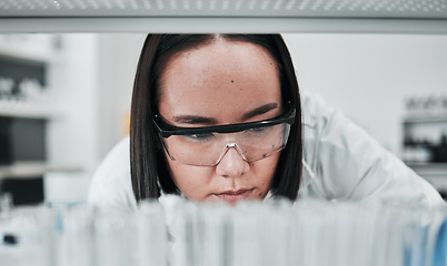Image showing Test tube, scientist and woman with lab investigation, thinking and science research of an Asian person. Laboratory, professional and healthcare with medicine and liquid check for hospital test