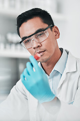 Image showing Science, test and man with tube in laboratory for chemical analysis, inspection and vaccine development. Asian scientist with blood sample for dna results, research investigation or pharma assessment