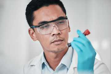 Image showing Scientist, face and man with blood test in laboratory for medical investigation, healthcare research and vaccine. Science, asian worker and red tube for dna analysis, development or chemistry results