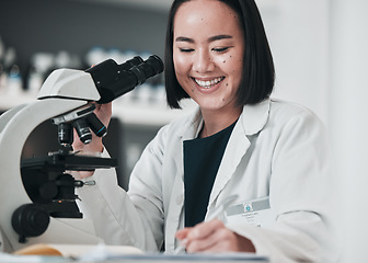 Image showing Microscope, happy woman and writing research in laboratory for science development, dna analysis and notes. Asian scientist, biotechnology and lens for medical investigation, test report and results