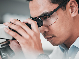 Image showing Microscope, face and man in medical laboratory for research, dna analysis or development of science innovation. Asian scientist, biotechnology or check lens for investigation, particles or assessment