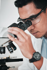 Image showing Microscope, face of man and laboratory for science research, dna analysis and studying chemical development. Asian scientist, biotechnology and check lens to review investigation, test and assessment
