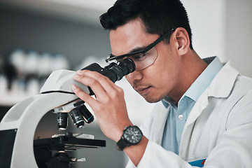 Image showing Man, scientist and microscope in forensic science, research or new discovery at laboratory. Male person, medical or healthcare specialist looking in scope for DNA, vaccine or cure to virus in lab