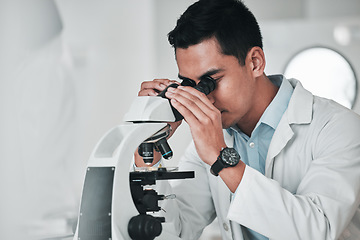 Image showing Man, scientist and microscope in forensic, research or new science discovery at laboratory. Male person, medical or healthcare specialist looking in scope for DNA, vaccine or cure to virus in lab