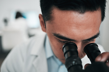 Image showing Man, scientist and microscope in forensic study, research or science discovery at laboratory. Closeup of male person, medical or specialist looking in scope for DNA, vaccine or cure to virus in lab