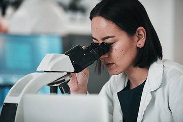 Image showing Science, microscope and Asian woman in laboratory for research, data analysis and study. Biotechnology, healthcare and scientist looking in equipment for medical innovation, sample and DNA testing