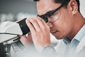 Image showing Man, scientist and microscope in forensic discovery, research or science study at laboratory. Closeup of male person, medical or specialist looking in scope for DNA, vaccine or cure to virus in lab