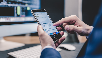 Image showing Close up of businessman using mobile smart phone.