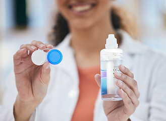Image showing Optometry, contact lens and solution in hands, container and healthcare with eye care and wellness closeup. Person with bottle, vision and optometrist at clinic, case for lenses with advice and help