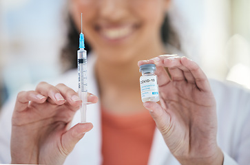 Image showing Hands, needle and vaccine bottle with person in healthcare, safe from covid with closeup, medicine and treatment. Health, syringe and immunity from virus, pharmaceutical and injection for protection