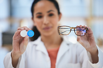 Image showing Hands, glasses and contact lens, woman with choice of eye care and help with optometry, vision and healthcare closeup. Doctor, frame and lenses container with decision, advice and ophthalmologist
