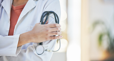 Image showing Woman, doctor and hands with stethoscope of professional in healthcare, cardiology or advice at hospital. Closeup of female person or medical expert with arms crossed, equipment or examination tool