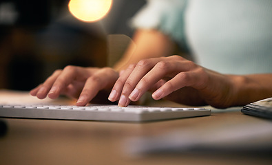 Image showing Hands, keyboard and a business person typing in an office closeup at night for overtime project management. Computer, email and desk with an employee working on a report or assignment in the evening