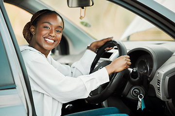Image showing Woman, driving car and portrait in driver seat with license, freedom and travel on road trip. Black female person in automobile, transport or vehicle for test, transportation and excited for journey