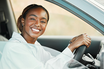 Image showing Woman, driving car and portrait in window with driver license, freedom and travel on a road trip. Black female person in automobile, transport or vehicle test, transportation and excited for journey