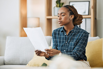 Image showing Planning insurance, budget or black woman with paperwork, bank document and investment report in home. Savings, African or person reading student loan information for financial future on house sofa