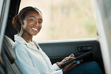 Image showing Portrait, tablet and a business black woman a taxi for transport or ride share on her commute to work. Smile, technology and a happy young employee in the backseat of a cab for travel as a passenger