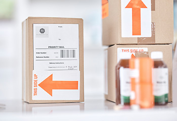 Image showing Boxes, medicine and delivery package in pharmacy for ecommerce, supply chain and healthcare on blurred background. Stock, logistics and medical product or drug distribution for health and wellness