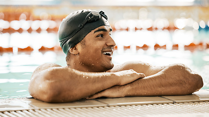 Image showing Happy, man and athlete in swimming pool water after training, workout or exercise for wellness, performance or fitness. Swimmer, relax or smile for sport, challenge or health in race competition