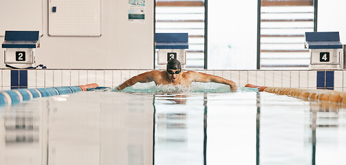 Image showing Swimming exercise, pool and sports man doing water challenge, cardio training or butterfly stroke action. Motivation, athlete and swimmer workout, practice or training for competition, match or race