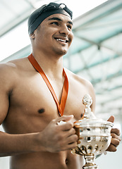 Image showing Sports winner, swimming trophy and happy man with competition success, fitness achievement and winning race. Happiness, athlete and swimmer with prize, pride and champion smile at challenge event