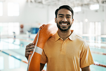 Image showing Lifeguard portrait, swimming pool and man with safety and lifebuoy for rescue support, help or life saving. Smile, equipment and first aid expert for protection, security and medical emergency