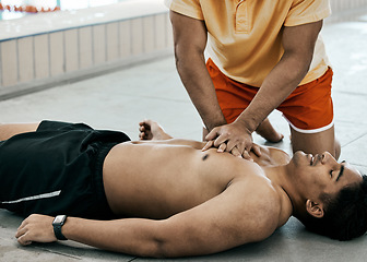 Image showing Cpr, first aid and rescue with people at swimming pool for healthcare, emergency and safety. Paramedic, helping and medical with lifeguard saving man for breathing, danger and drowning accident