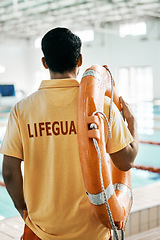 Image showing Swimming pool lifeguard and person with lifebuoy safety equipment and watch for rescue support, help or service. Surveillance, attention and back of expert for emergency assistance for public danger