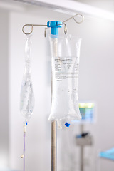 Image showing Hospital, healthcare and an iv drip for medicine in a ward for medical support, health or emergency. Surgery, room and equipment or a liquid or fluid bag in icu at a clinic for medication help