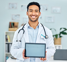 Image showing Portrait of doctor with tablet, screen and healthcare app in hospital office, online medicine mockup. Telehealth, man with smile and digital information on medical website, advice and help in clinic.