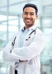 Image showing Portrait of doctor with smile, confidence and hospital employee with care, support and trust. Health insurance, happy man and medical professional with arms crossed in healthcare career for advice.
