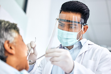 Image showing Covid, dental or healthcare with a dentist and patient in an office for oral surgery or operation. Medical, teeth and oral hygiene with a medicine professional in a clinic to examine mouth and gums